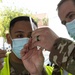 Soldiers with 4th Infantry Division perform vaccinations at California State University Los Angeles