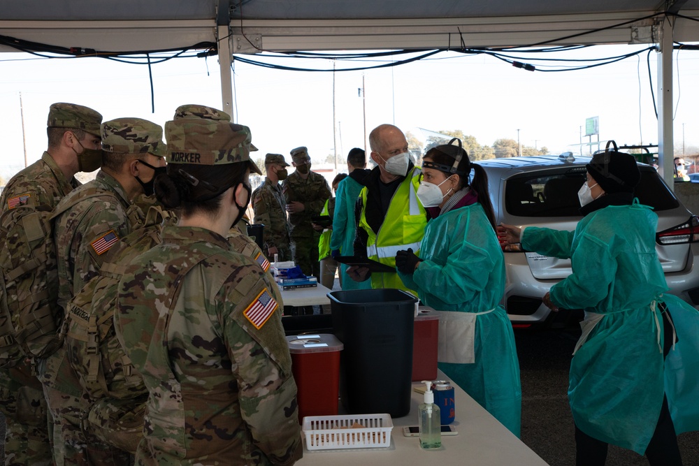 U.S. Army Soldiers shadow medical workers at Community Vaccination Center