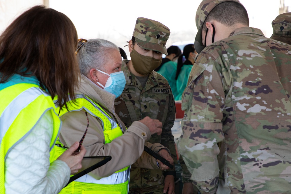 U.S. Army Soldiers shadow medical workers at Community Vaccination Center