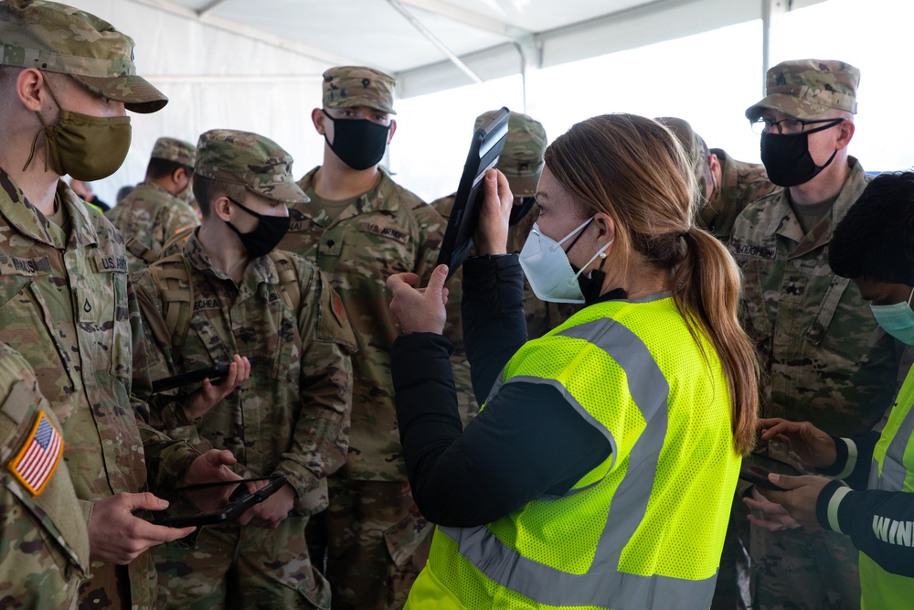 U.S. Army Soldiers shadow medical workers at Community Vaccination Center