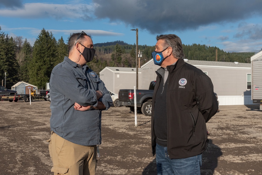 Officials talk at Mill City FEMA housing installation project