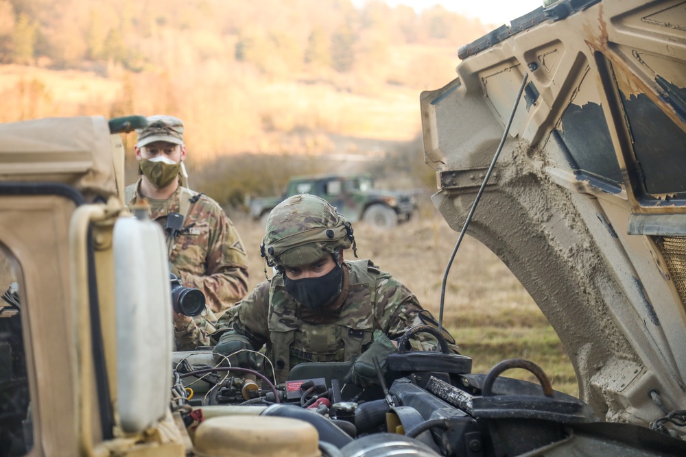 Inspecting a Humvee