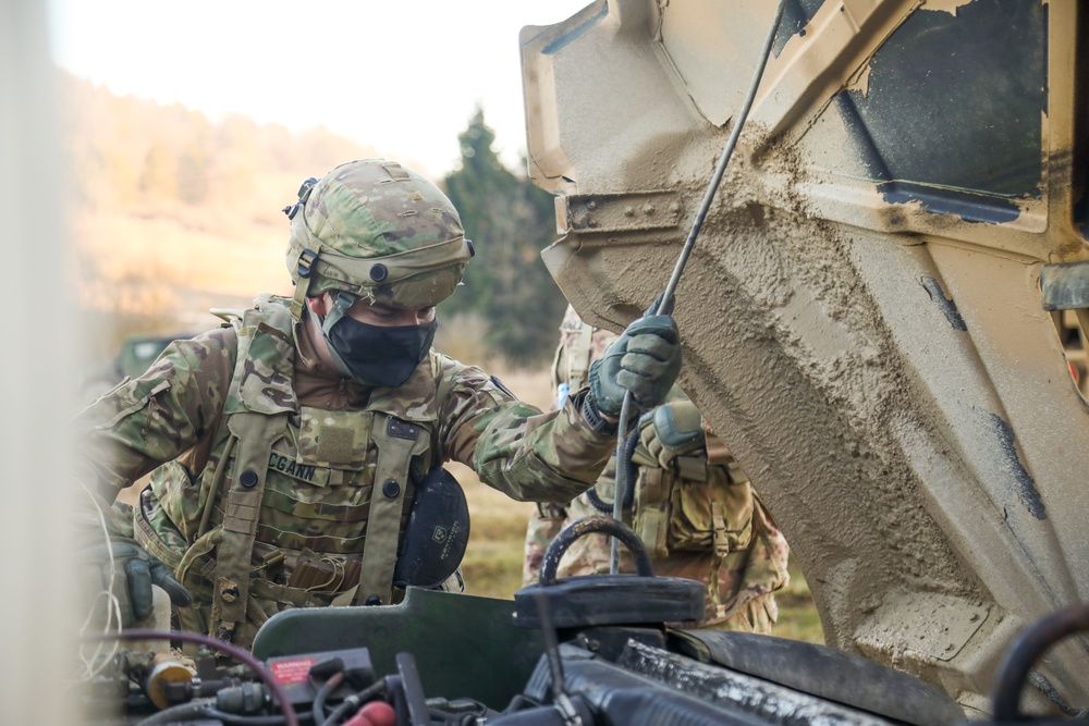 Inspecting a Humvee