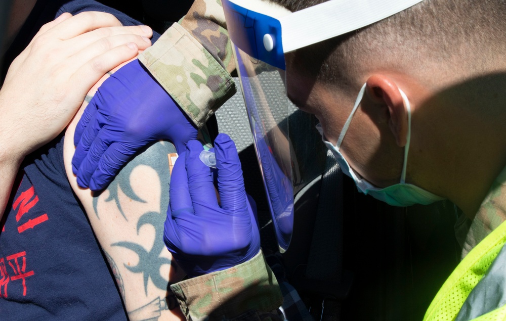 4th Infantry Division Soldiers vaccinate community members at the California State University Los Angeles Community Vaccination Center