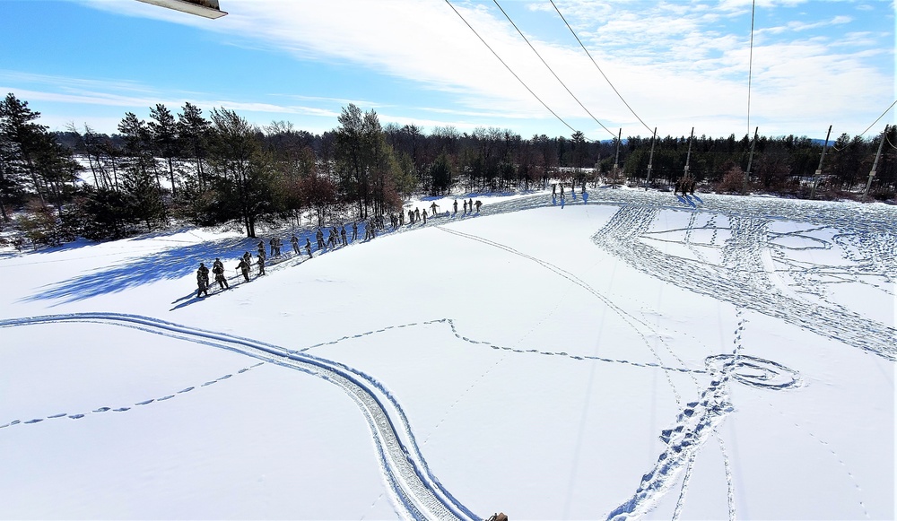 Fort McCoy Cold-Weather Operations Course Class 21-04 students conduct field training in snowshoes