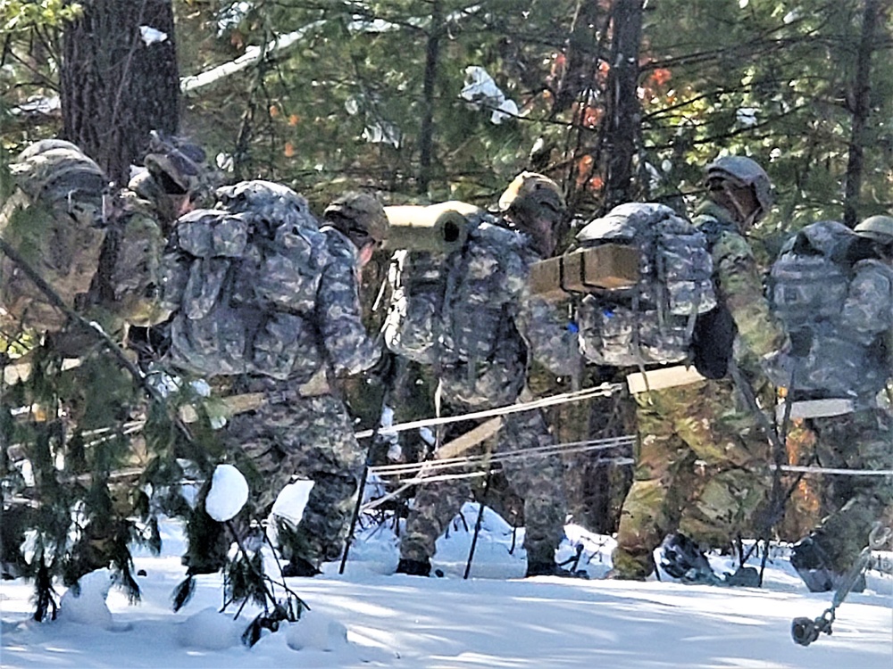 Fort McCoy Cold-Weather Operations Course Class 21-04 students conduct field training in snowshoes