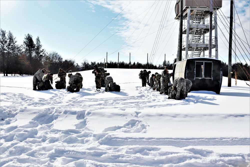Fort McCoy Cold-Weather Operations Course Class 21-04 students conduct field training in snowshoes
