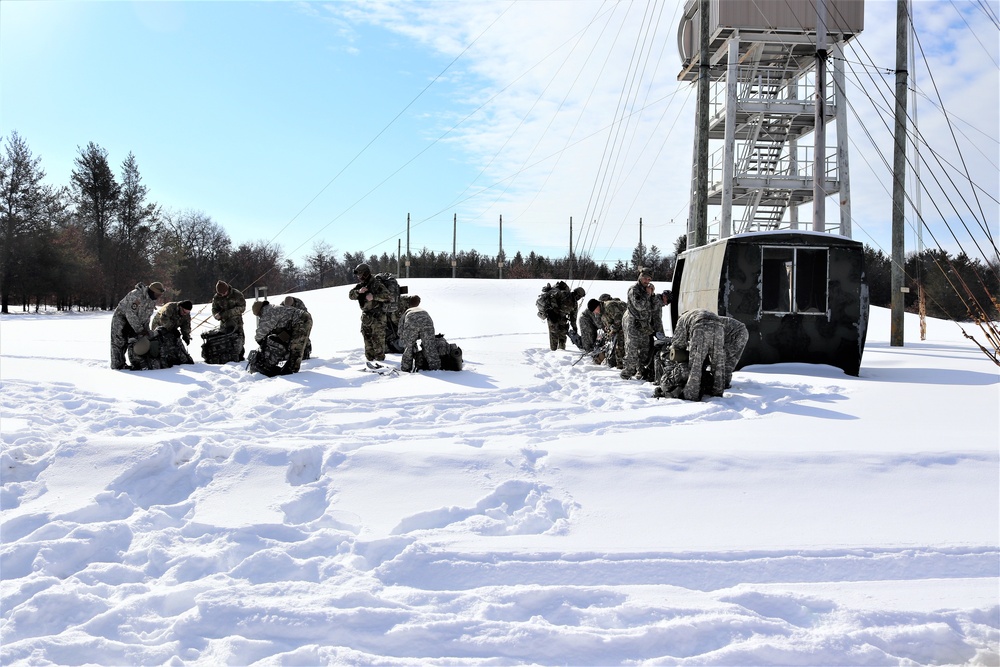 Fort McCoy Cold-Weather Operations Course Class 21-04 students conduct field training in snowshoes