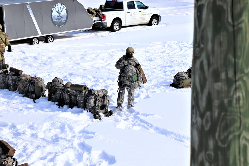 Fort McCoy Cold-Weather Operations Course Class 21-04 students conduct field training in snowshoes