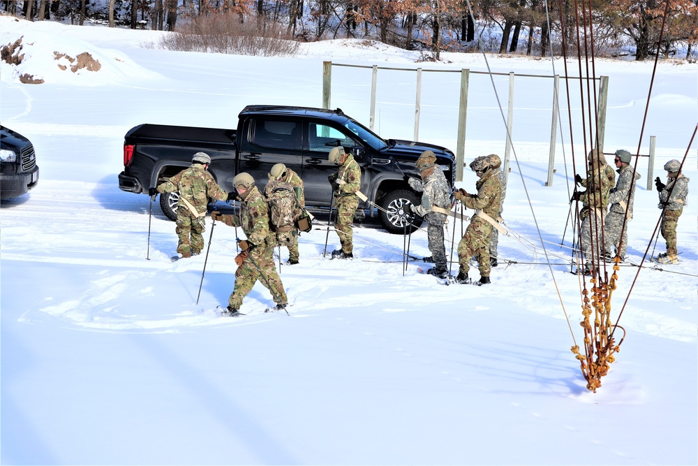 Fort McCoy Cold-Weather Operations Course Class 21-04 students conduct field training in snowshoes