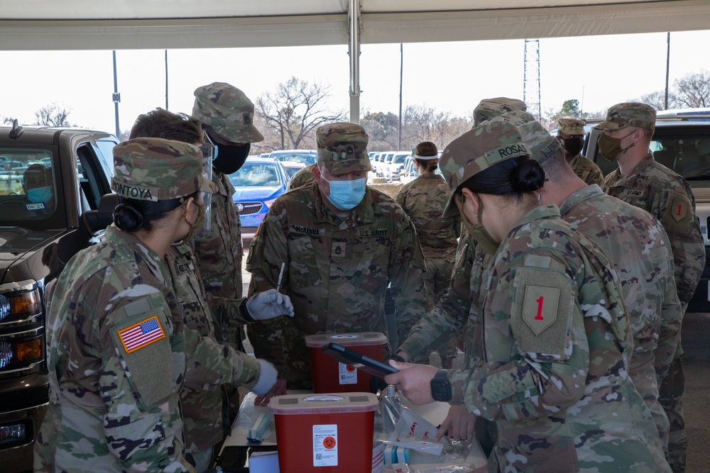 U.S. Army Soldiers administer the COVID-19 vaccine