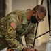 U.S. Army personnel begin in-processing for COVID Community Vaccination Center