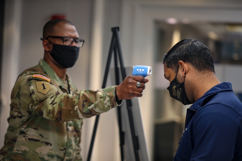 U.S. Army personnel begin in-processing for COVID Community Vaccination Center