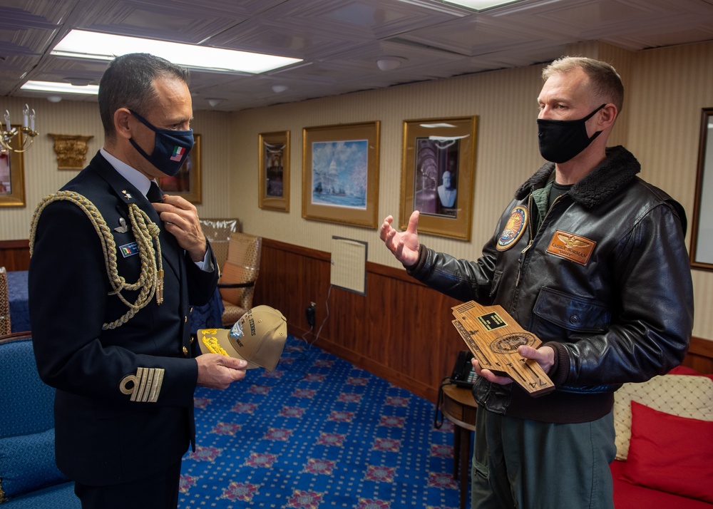 Italian Navy Capt. speaks to U.S. Navy Capt.