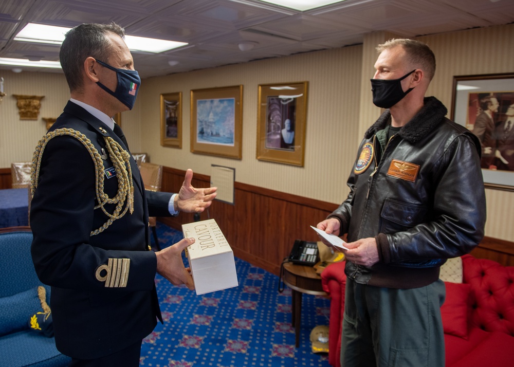 Italian Navy Capt. speaks to U.S. Navy Capt.