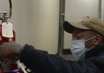 Sailor performs maintenance