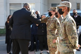 Cal Guard Airman receives challenge coin from Secretary of Defense
