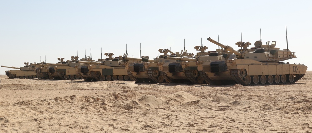 Iron Union 14, U.S. Army tanks from 1st Battalion, 6th Infantry Regiment, 2nd Brigade Combat Team, 1st Armored Division, stand ready to move