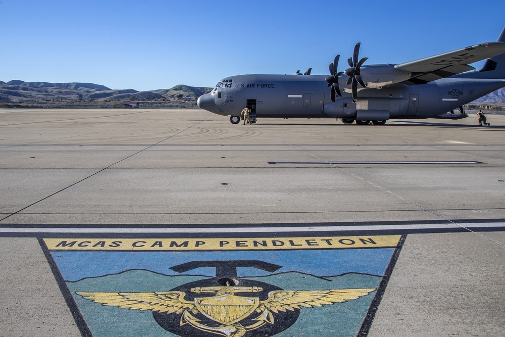 Marines, airmen work together to transport HIMARS