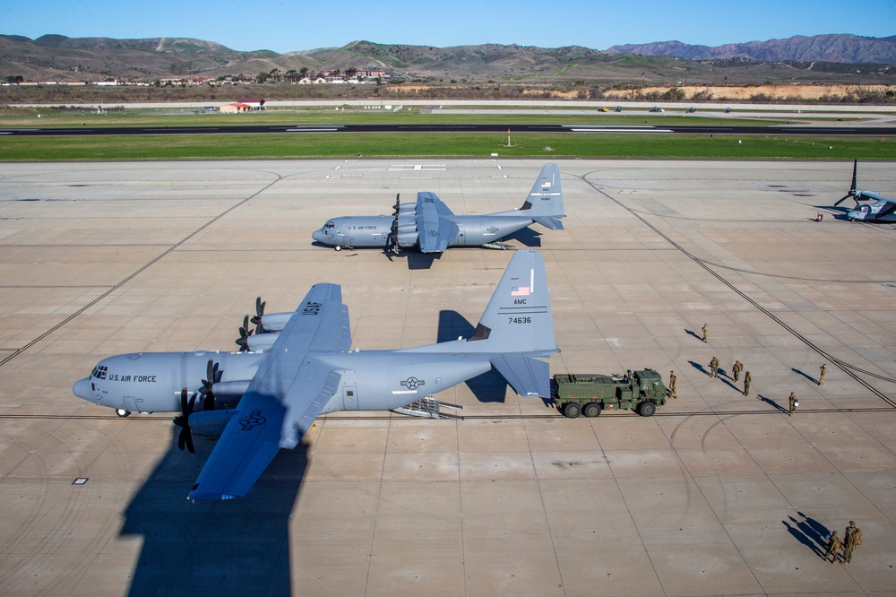 Marines, airmen work together to transport HIMARS