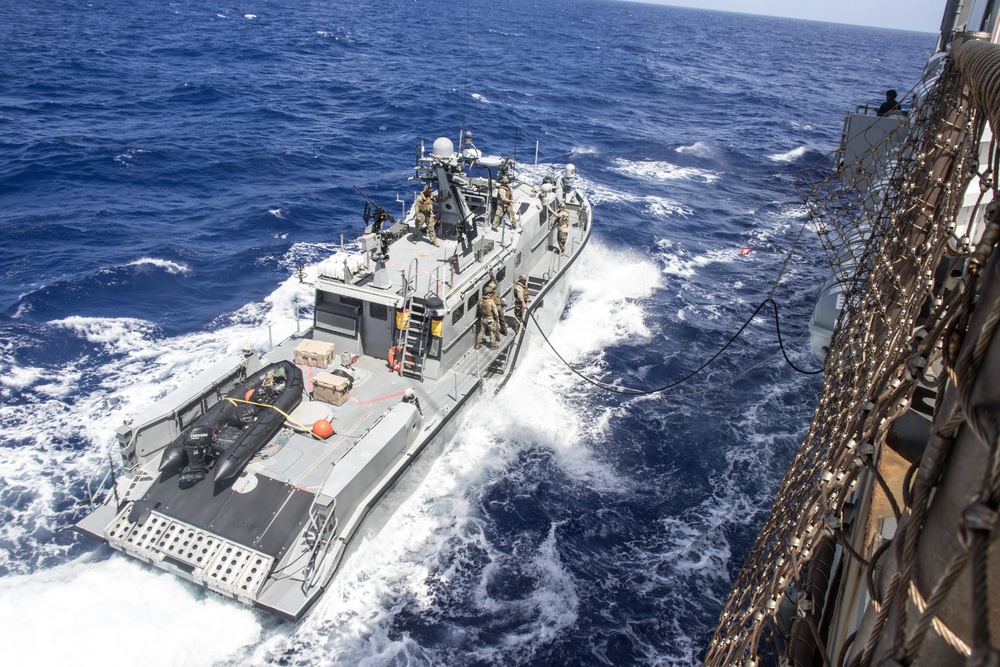 USS Ashland refuels and resupplies Mark VI patrol boat at sea