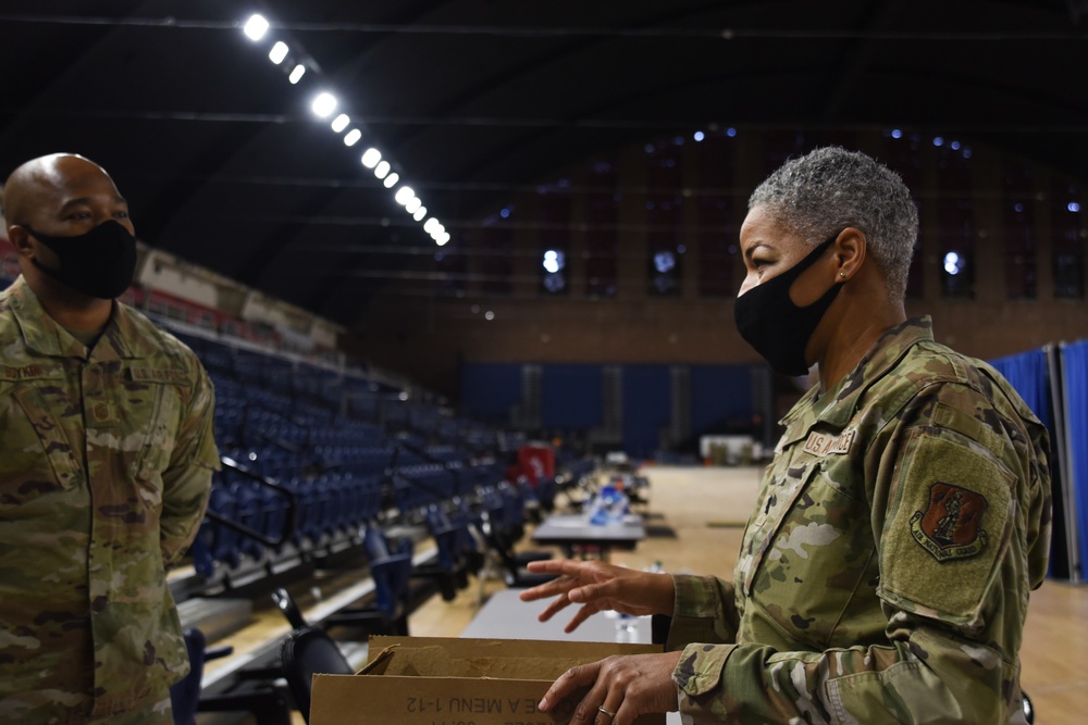 U.S. Air Force Lt. Col. Countess Cooper, a chaplain with the 113th Wing, District of Columbia Air National Guard, speaks with 1st Sgt. Marcus Boykin, member of the Operations Group, 113th Wing, DCANG, at the D.C. Armory in Washington, D.C., Feb. 17, 2021