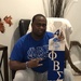 U.S. Air Force Lt. Col. Corwin Smith, a chaplain with the 113th Wing, District of Columbia Air National Guard, and a member of Phi Beta Sigma Fraternity, Inc., poses for a photo in his fraternity attire in 2014