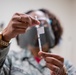 413th ASTS administers COVID-19 vaccine