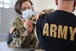 US Army Nurse Administers Covid-19 Vaccine to Retirees