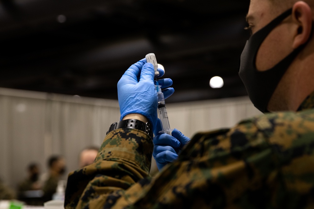 U.S. Marines and Sailors conduct vaccination rehearsals at the Community Vaccination Center in Philadelphia