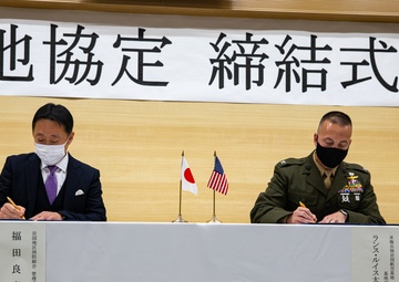 Col. Lance Lewis and Yoshihiko Fukuda co-sign Atago Humanitarian Assistance Local Implementation Agreement