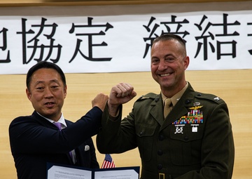 Col. Lance Lewis and Yoshihiko Fukuda co-sign Atago Humanitarian Assistance Local Implementation Agreement