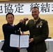 Col. Lance Lewis and Yoshihiko Fukuda co-sign Atago Humanitarian Assistance Local Implementation Agreement