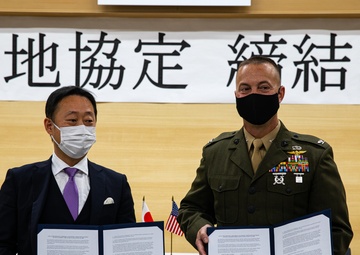 Col. Lance Lewis and Yoshihiko Fukuda co-sign Atago Humanitarian Assistance Local Implementation Agreement