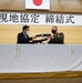 Col. Lance Lewis and Yoshihiko Fukuda co-sign Atago Humanitarian Assistance Local Implementation Agreement