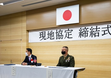 Col. Lance Lewis and Yoshihiko Fukuda co-sign Atago Humanitarian Assistance Local Implementation Agreement