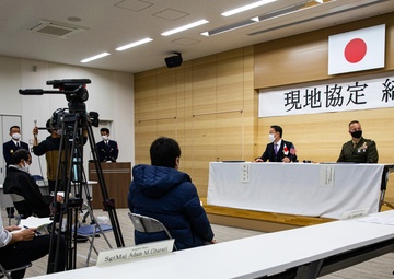 Col. Lance Lewis and Yoshihiko Fukuda co-sign Atago Humanitarian Assistance Local Implementation Agreement
