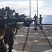 Reconnaissance Marines perform rifle drills aboard USS Germantown