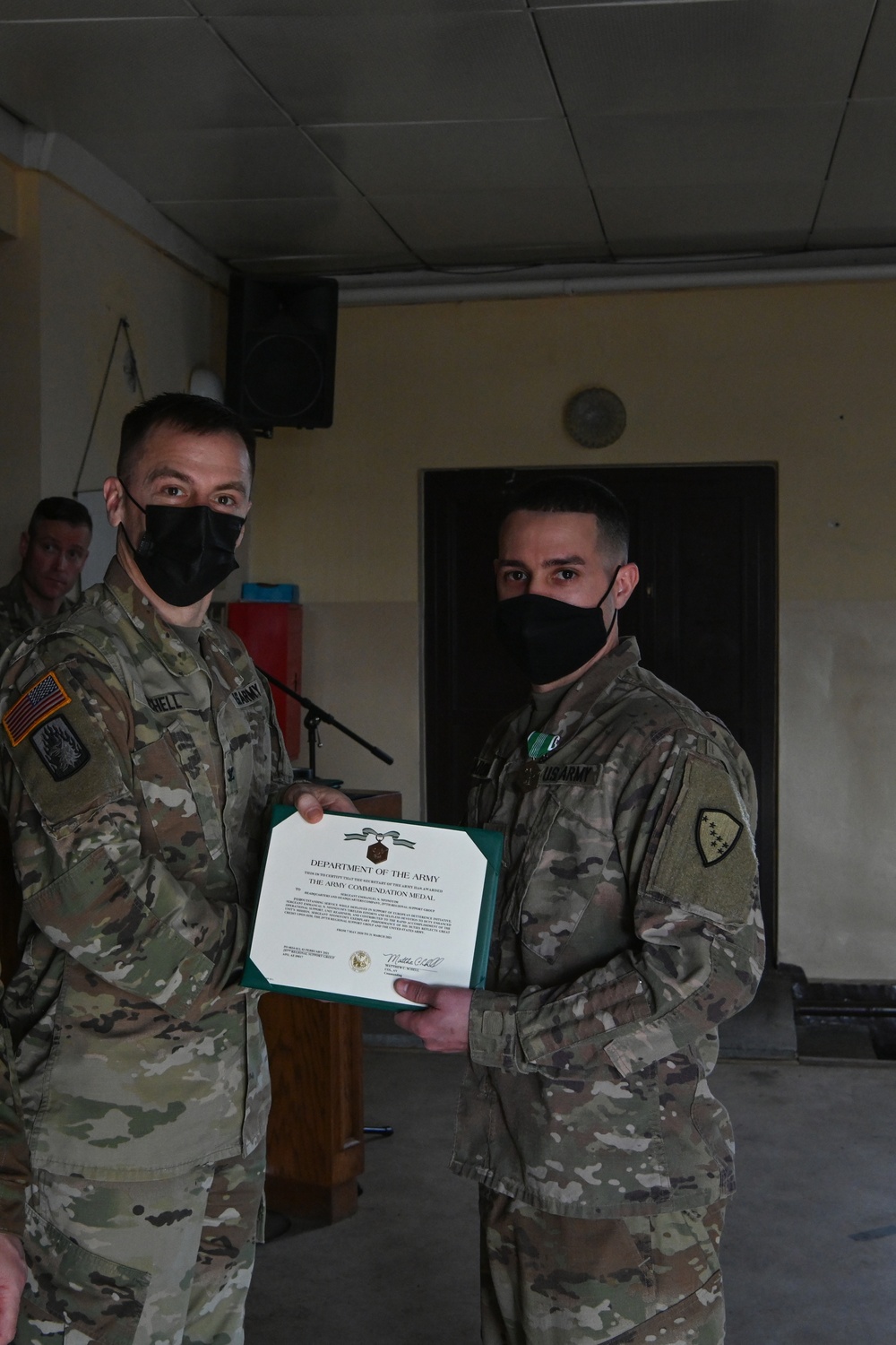 Alaska Army National Guard Staff Sergeant Angel Maldonado, 297th Regional Support Group, receives an Army Commendation Medal.