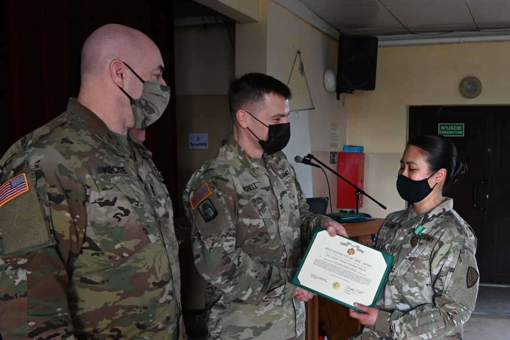 Alaska Army National Guard Sergeant Staff Sergeant Jennessymae Buendia, 297th Regional Support Group, receives an Army Commendation Medal.