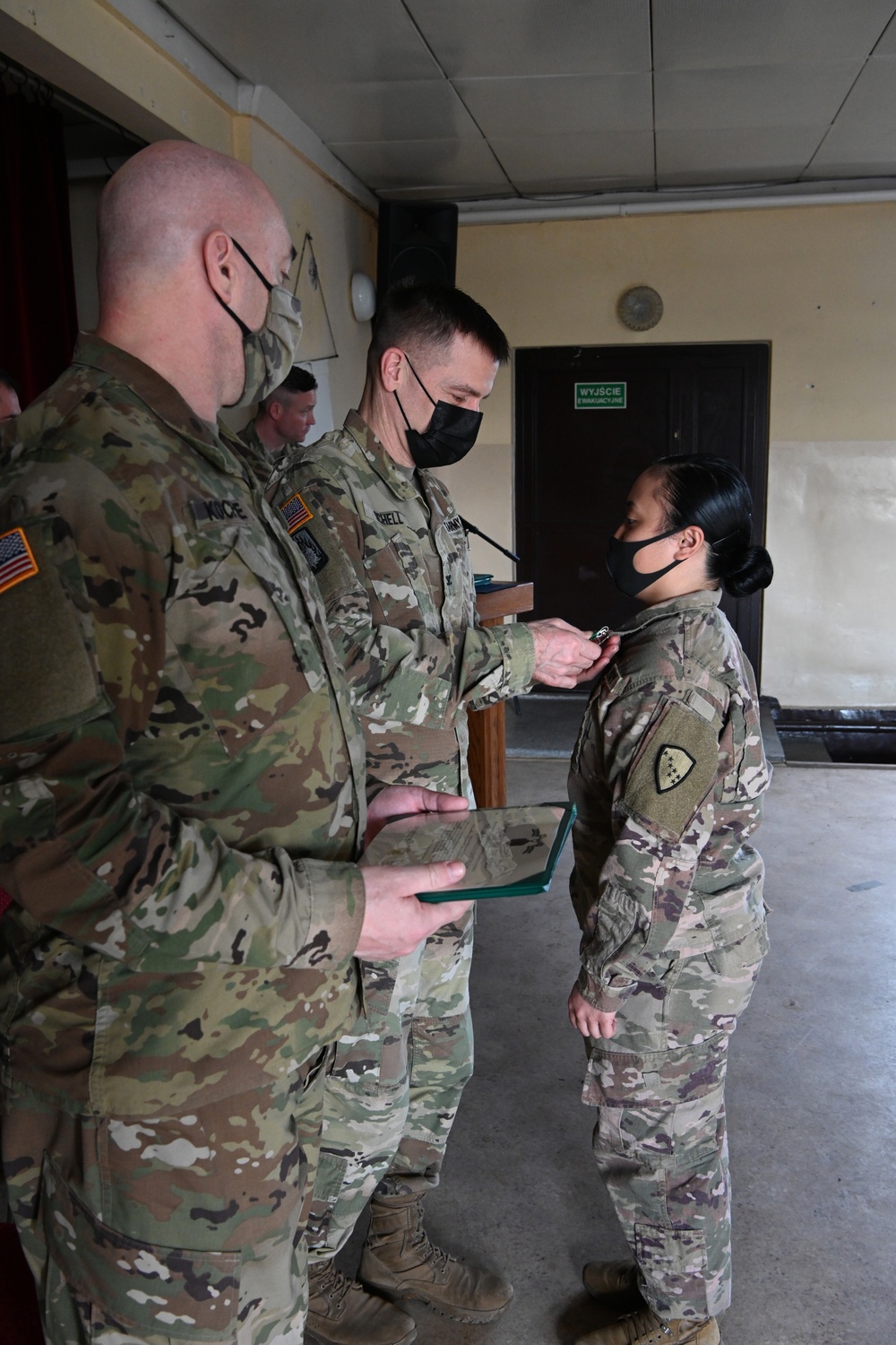 Alaska Army National Guard Sergeant Patricia Catacutan, 297th Regional Support Group, receives an Army Commendation Medal.