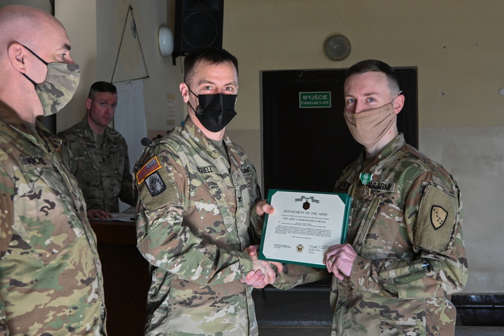 Alaska Army National Guard Sergeant Jacob Lunsford, 297th Regional Support Group, receives an Army Commendation Medal.