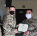 Alaska Army National Guard Staff Sergeant Jason Nocelo, 297th Regional Support Group, receives an Army Commendation Medal.