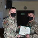 Alaska Army National Guard Specialist Nathan Aklines, 297th Regional Support Group, receives an Army Commendation Medal.