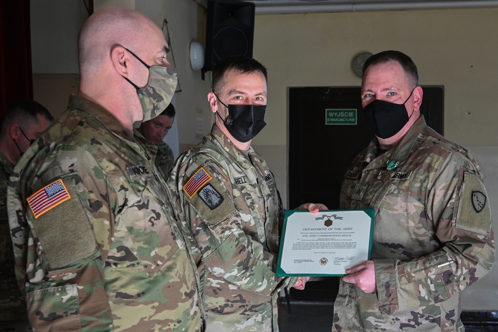 Alaska Army National Guard Sergeant John Carson, 297th Regional Support Group, receives an Army Commendation Medal.