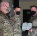 Alaska Army National Guard Sergeant John Carson, 297th Regional Support Group, receives an Army Commendation Medal.