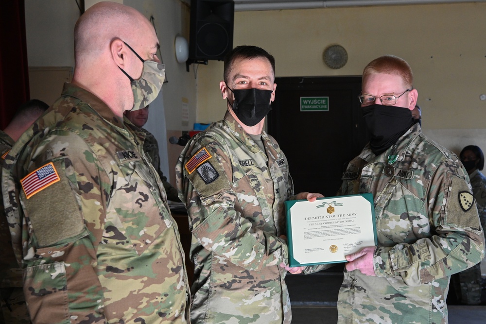 Alaska Army National Guard Sergeant Bradley Cunningham,297th Regional Support Group, receives an Army Commendation Medal.