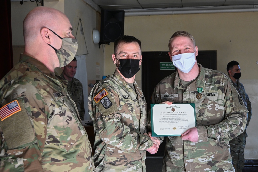 Alaska Army National Guard First Lieutenant Alexis Clodfelter, 297th Regional Support Group, receives an Army Commendation Medal.