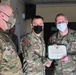 Alaska Army National Guard First Lieutenant Alexis Clodfelter, 297th Regional Support Group, receives an Army Commendation Medal.