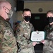 Alaska Army National Guard First Lieutenant Balinda Dresel, 297th Regional Support Group, receives an Army Commendation Medal.